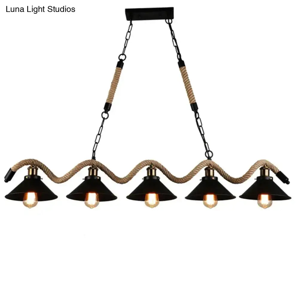 Black industrial led chandelier with five conical shades suspended by beige hemp rope and black metal chains