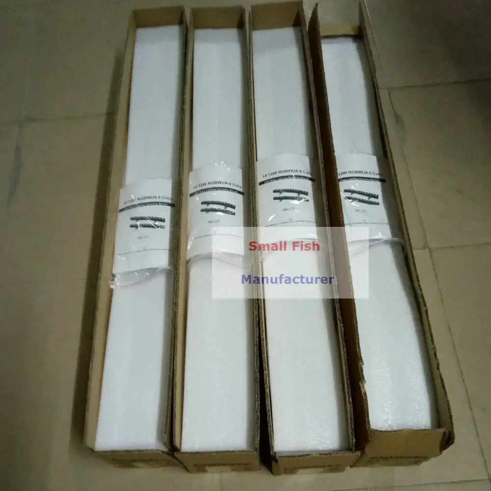 Four white foam-wrapped industrial black led wall wash lights in cardboard boxes labeled 16/20v norwia co for party use
