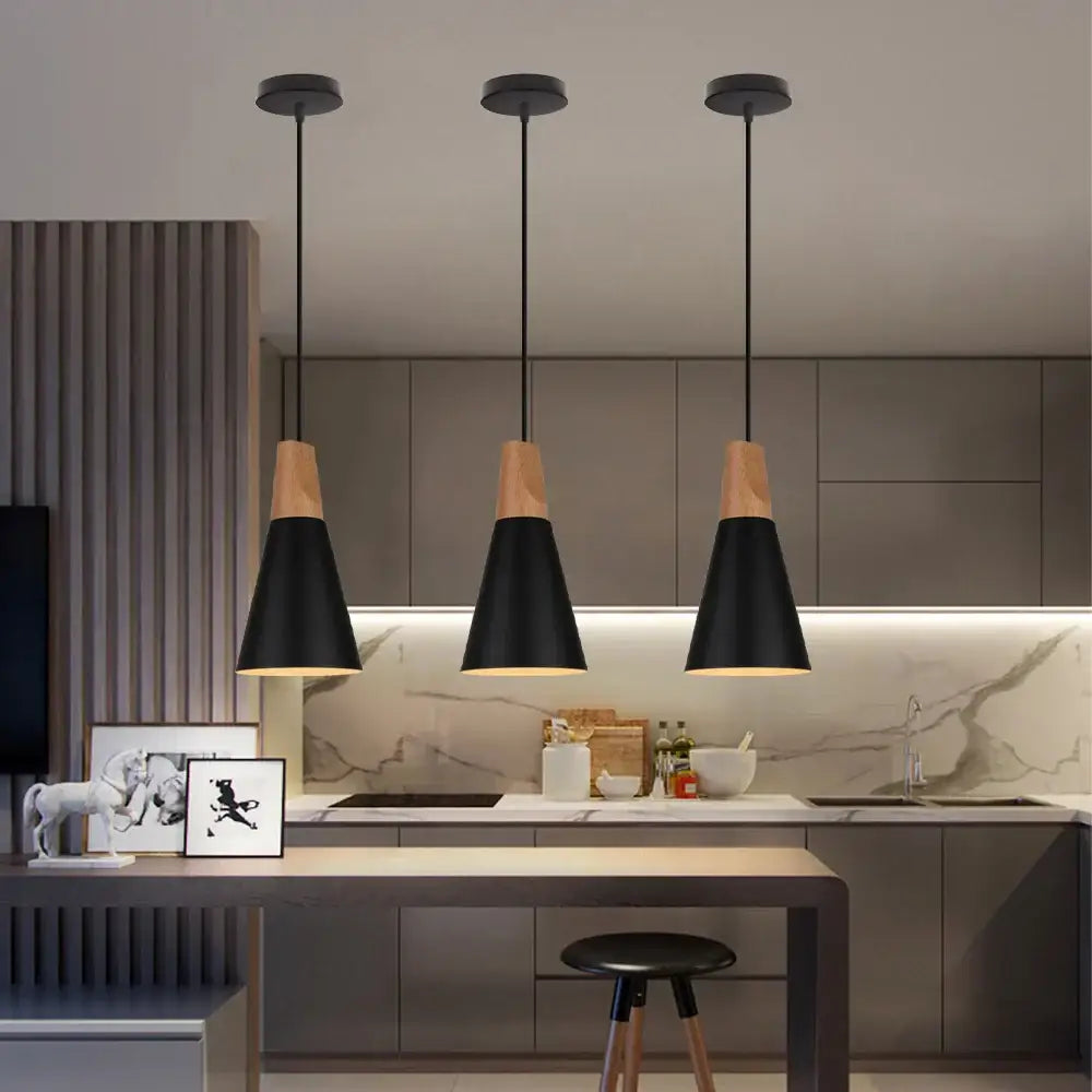 Three industrial aluminium pendant lights with black matte conical shades and wood accents for kitchen decorbites design
