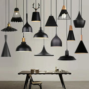 Industrial black matte aluminium pendant light with wooden accents and wire cage design for kitchen decorbites industrial aluminium pendant