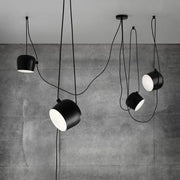 Industrial black matte spider pendant lamp with sleek cylindrical shades and exposed cords for dining room decorbites industrial spider