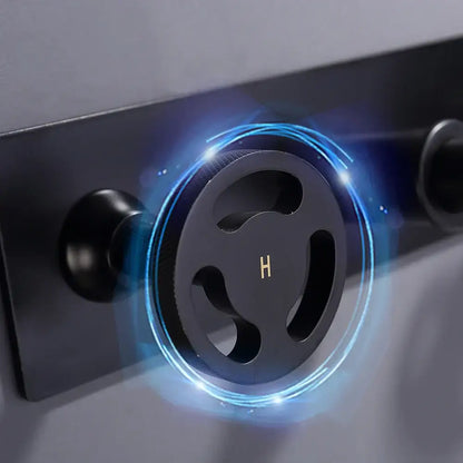 Industrial black matte wall mounted basin faucet with black circular showerhead and glowing blue light decorbites black wall mounted