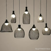 Industrial black mesh pendant light featuring various bottle-shaped and dome designs for dining room decorbites industrial birdcage chandelier