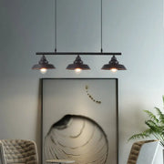 Black industrial metal pendant light with three dome shades and chain cord length for dining room chandelier use