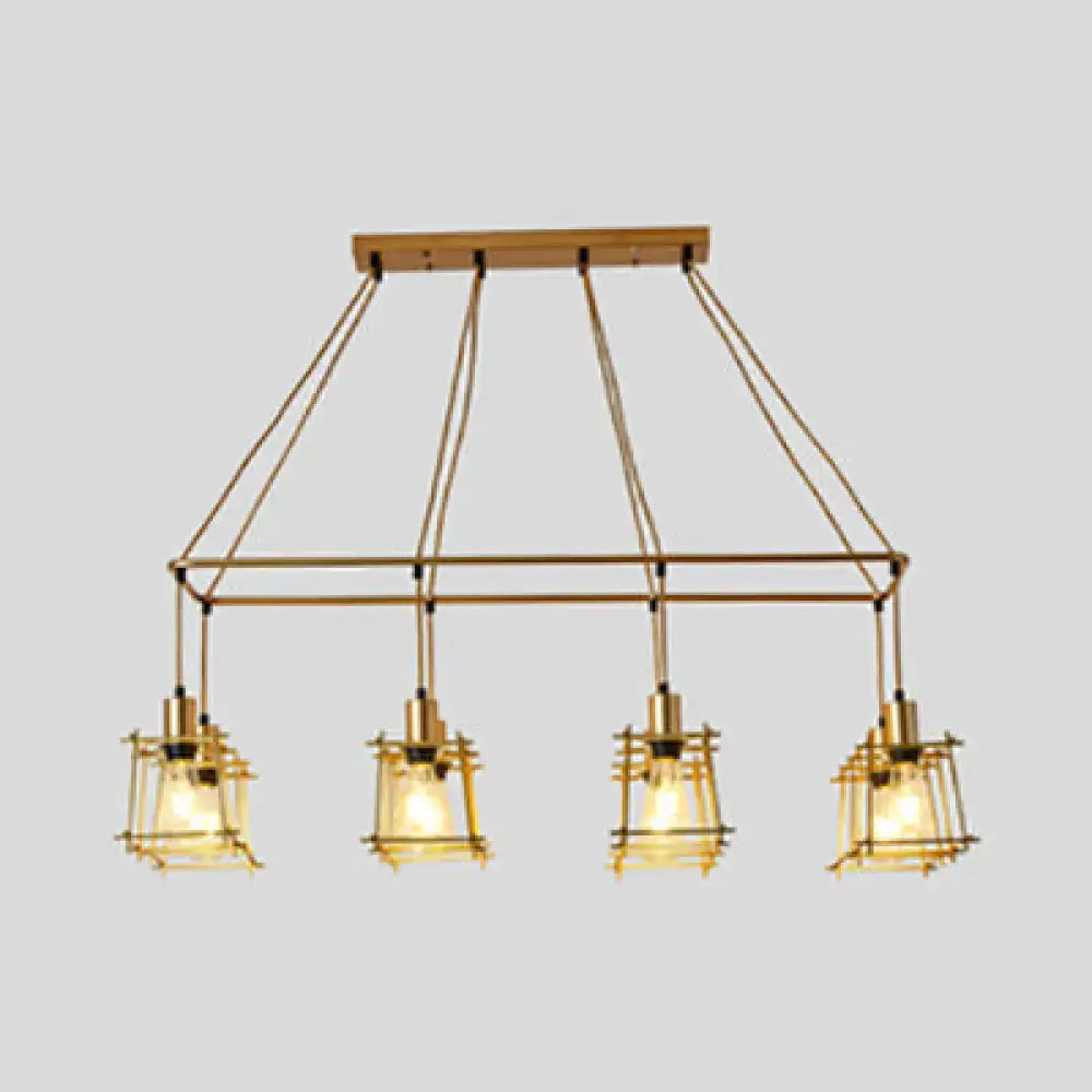 Brass industrial-style pendant light with four lanterns and wooden ceiling mount perfect as an island pendant light