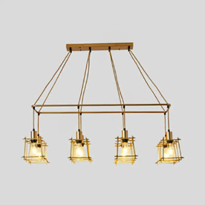 Brass industrial-style pendant light with four lanterns and wooden ceiling mount perfect as an island pendant light