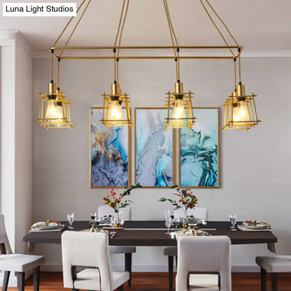 Gold-toned industrial style island pendant light with geometric cage design and exposed bulbs by decorbites