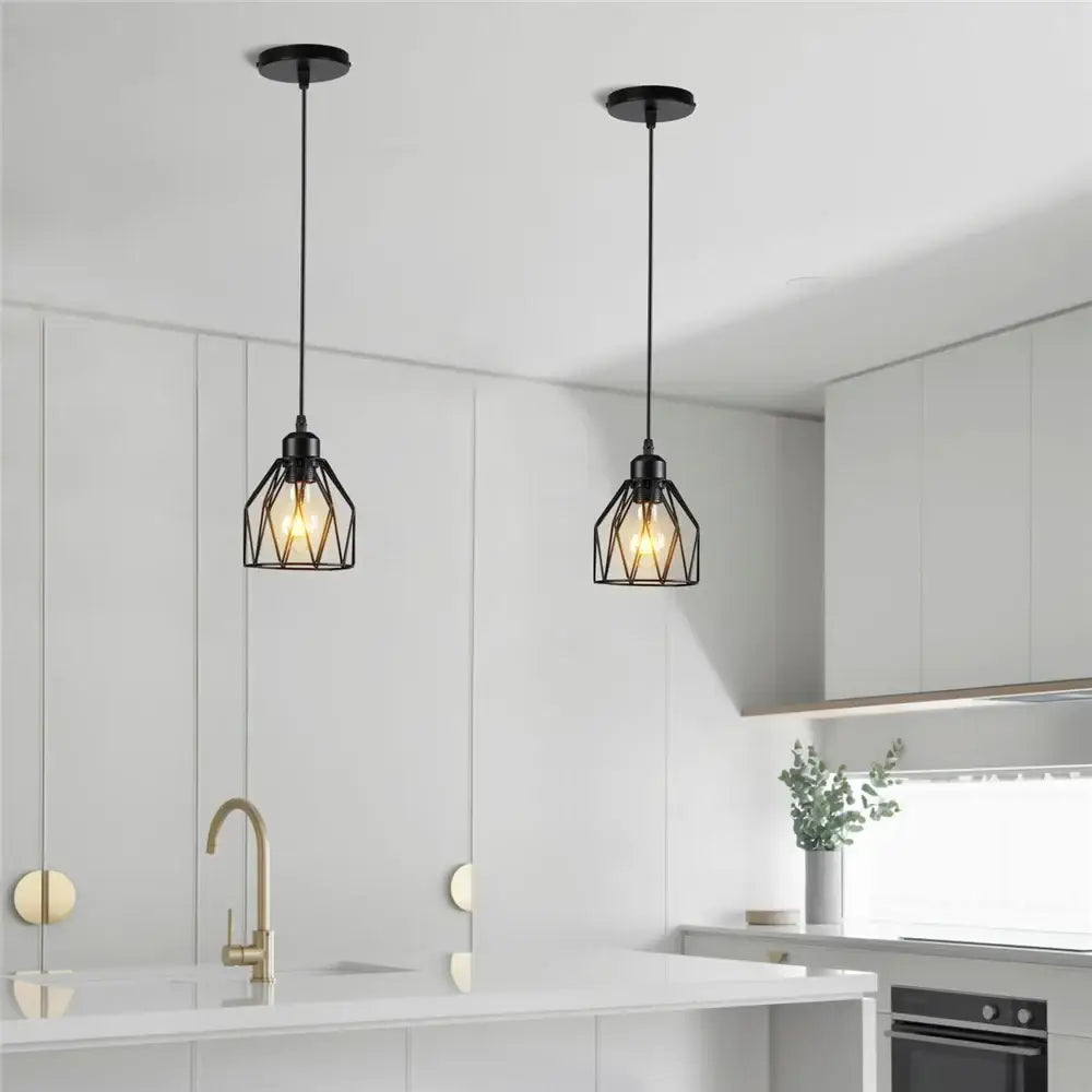 Industrial black metal cage mini pendant light with exposed filament bulbs ideal for dining room lighting