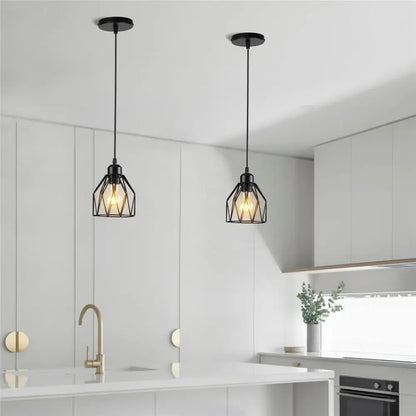 Industrial black metal cage mini pendant light with exposed filament bulbs ideal for dining room lighting