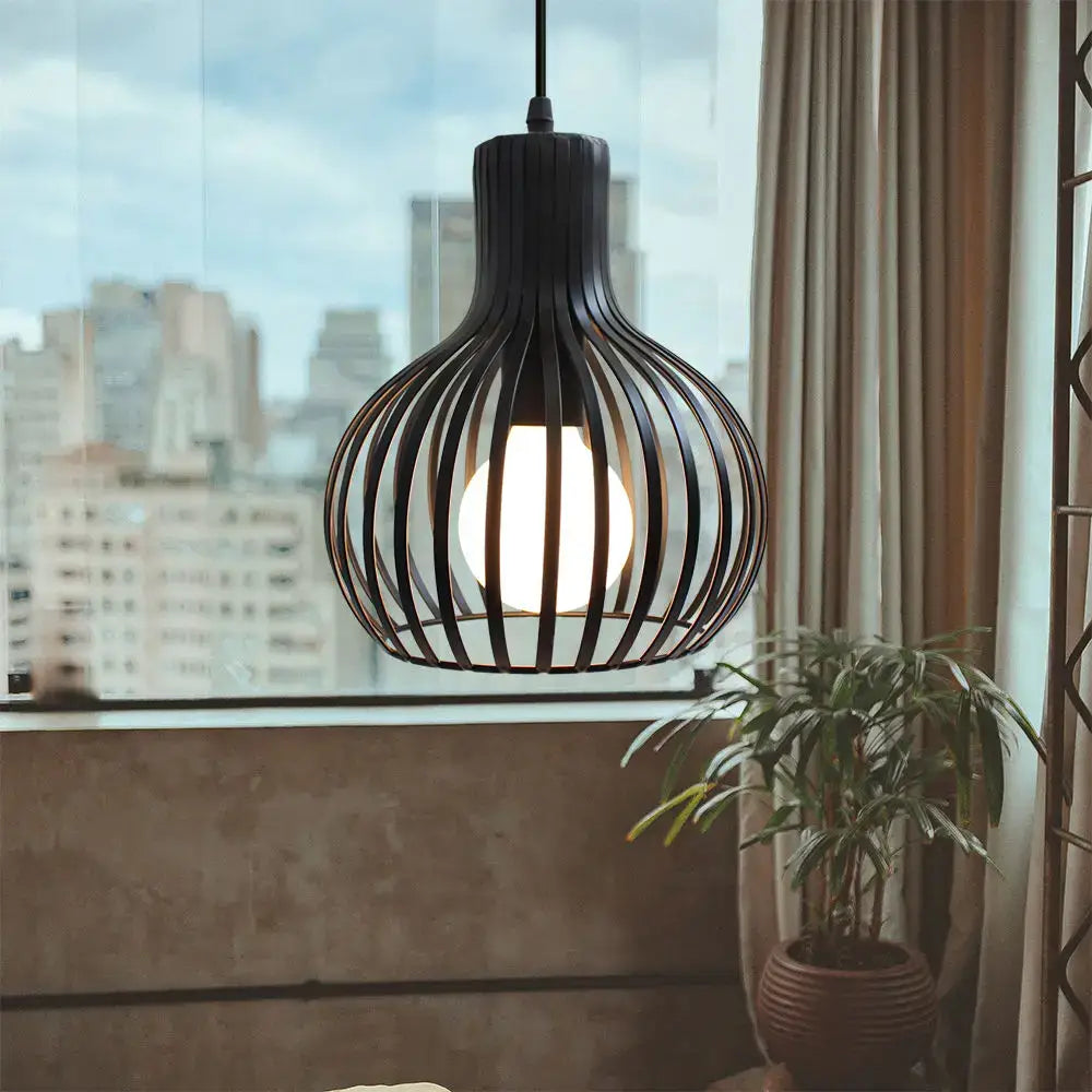 Black wrought iron pendant light with spherical cage design and warm glow ideal for decorbites industrial led decor