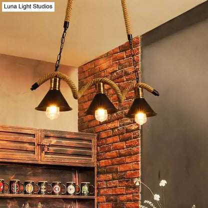 Decorbites industrial metal conical island ceiling light with three dark metal shades and thick wavy hemp rope suspension