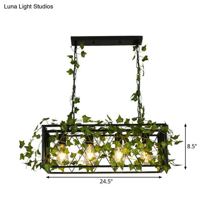Industrial black metal cuboid plant island lamp featuring a rectangular light fixture with ivy vines and four bulbs