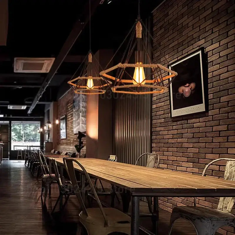 Industrial black metal pendant light with hexagonal woven rope frame and exposed Edison bulb ceiling light fixture