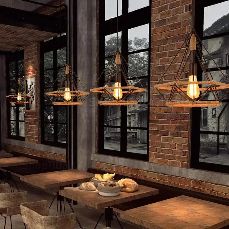 Industrial black metal diamond pendant light with geometric metal finish and warm-toned rope accents ceiling light