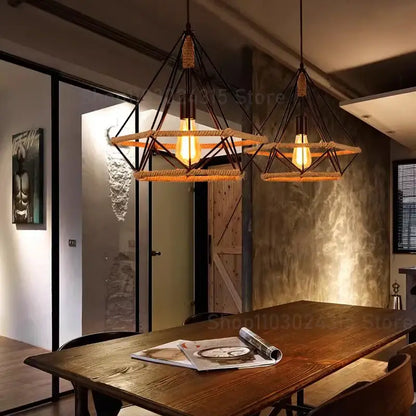 Industrial black metal diamond pendant light with woven rope accents and exposed incandescent bulbs for dining room