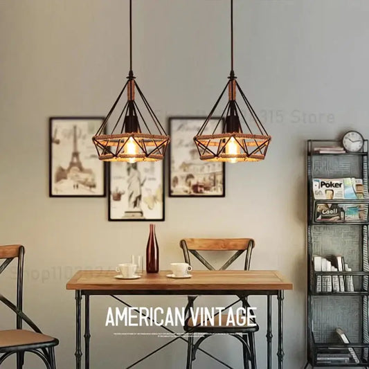 Industrial black metal diamond pendant light with warm glowing bulbs featuring a metal finish ceiling light design