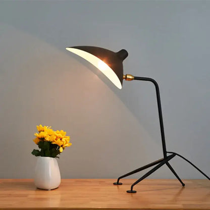 Industrial black metal floor lamp with sleek curved black serge mouille shade and gold-toned joint decorbites black serge