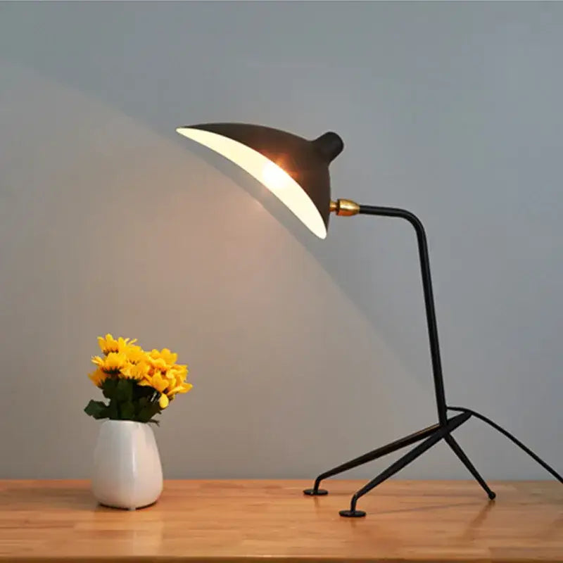 Industrial black metal floor lamp with sleek curved black serge mouille shade and gold-toned joint decorbites black serge