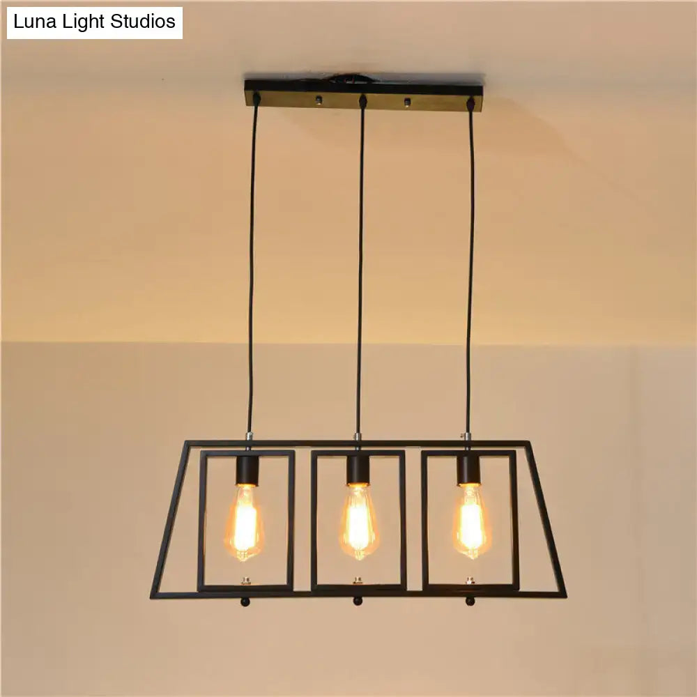 Black metal hanging pendant light with trapezoid frame and three exposed edison bulbs for kitchen island
