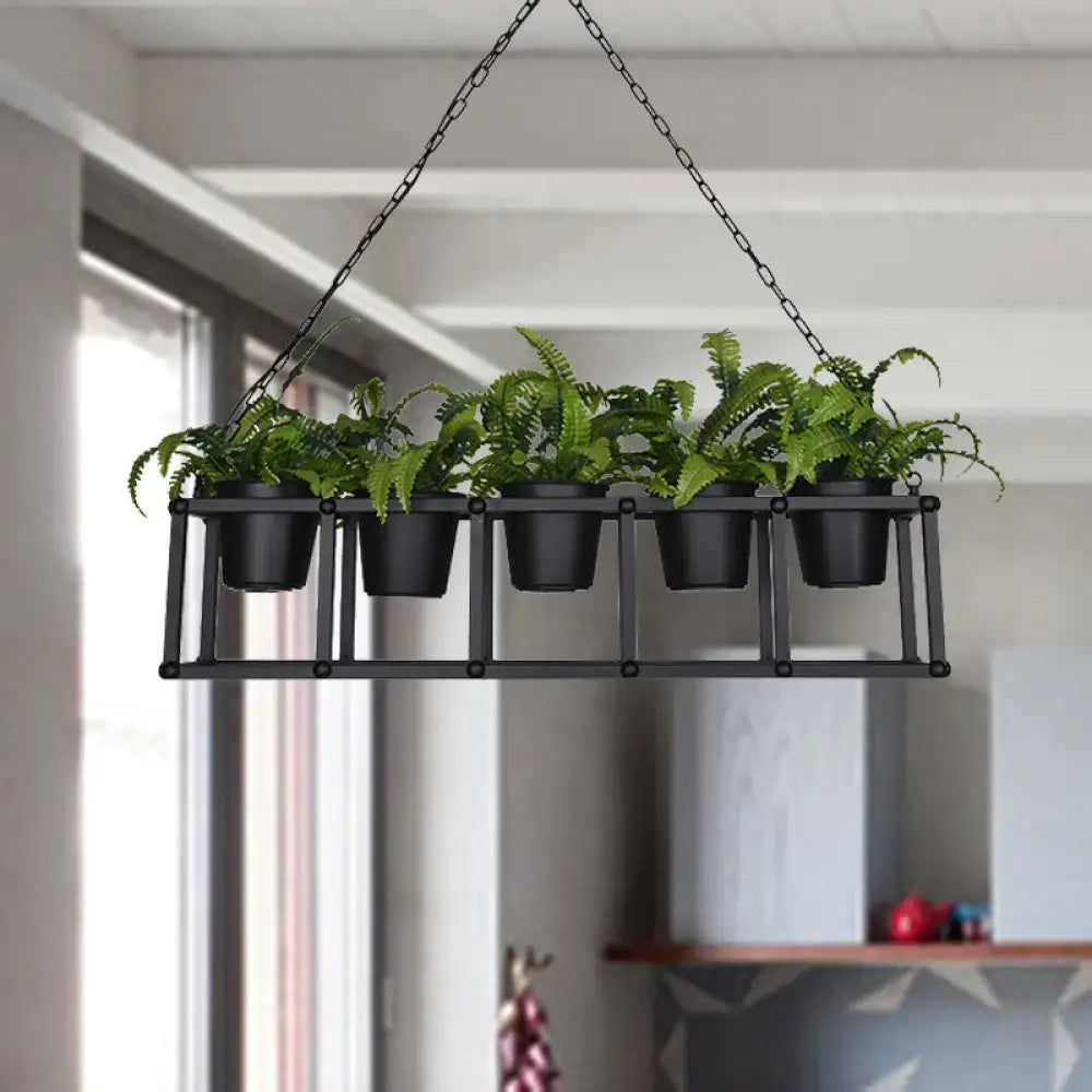 Decorbites™ black metal industrial rectangle island light fixture with hanging plant rack and five green ferns in black pots
