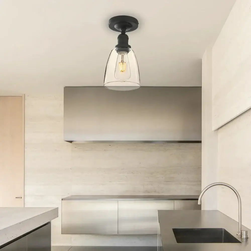 Black metal loft bar pendant light with clear glass bell-shaped shade and exposed filament bulb for kitchen decorbites loft bar