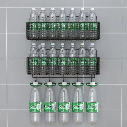 Black metal mesh two tier wall shelf organizer holding clear plastic water bottles with green labels for kitchen storage