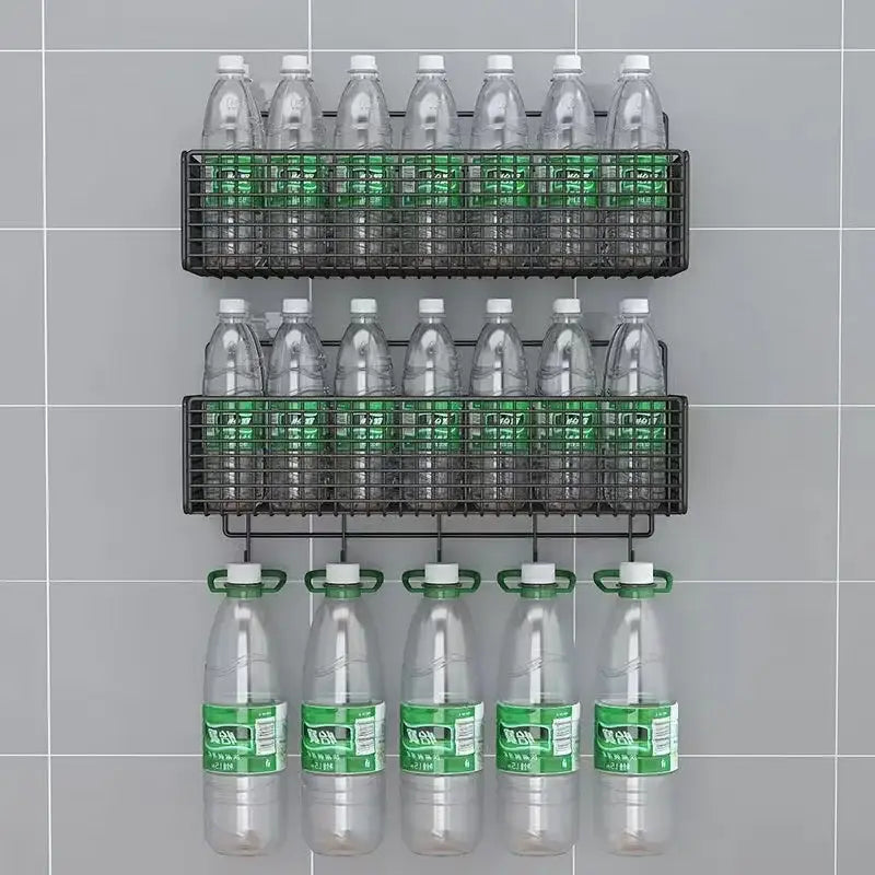 Black metal mesh two tier wall shelf organizer holding clear plastic water bottles with green labels for kitchen storage