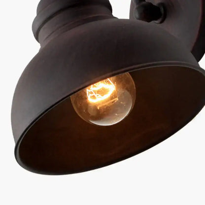 Industrial black metal outdoor wall lamp with warm glowing filament bulb decorbites industrial led wall lamp