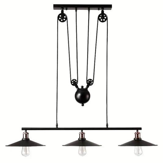 Industrial black metal pulley pendant light with three exposed bulbs and central pulley system for kitchen island use