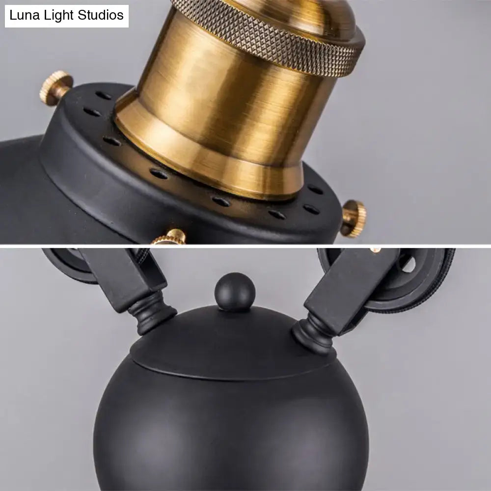 Industrial black metal pulley pendant light with black matte spherical lampshade and brass knurled top for kitchen island