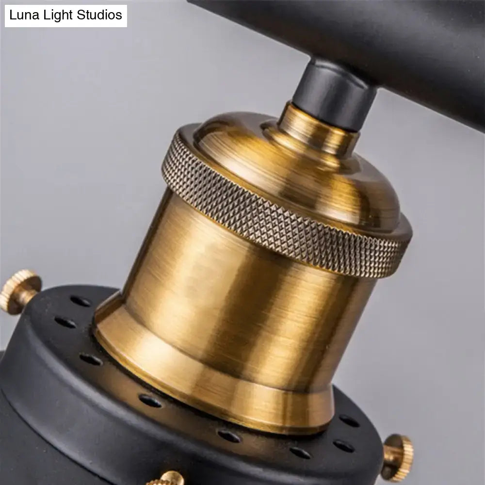 Industrial black metal pulley pendant light socket with brass finish, textured knurled ring, and black mounting base