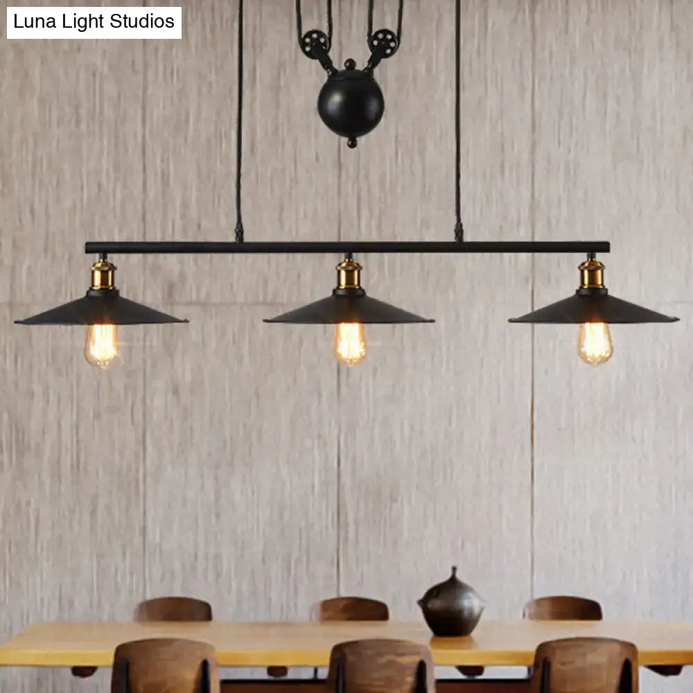 Industrial black metal pulley pendant light set of 3 with exposed edison bulbs and brass accents for kitchen island lighting