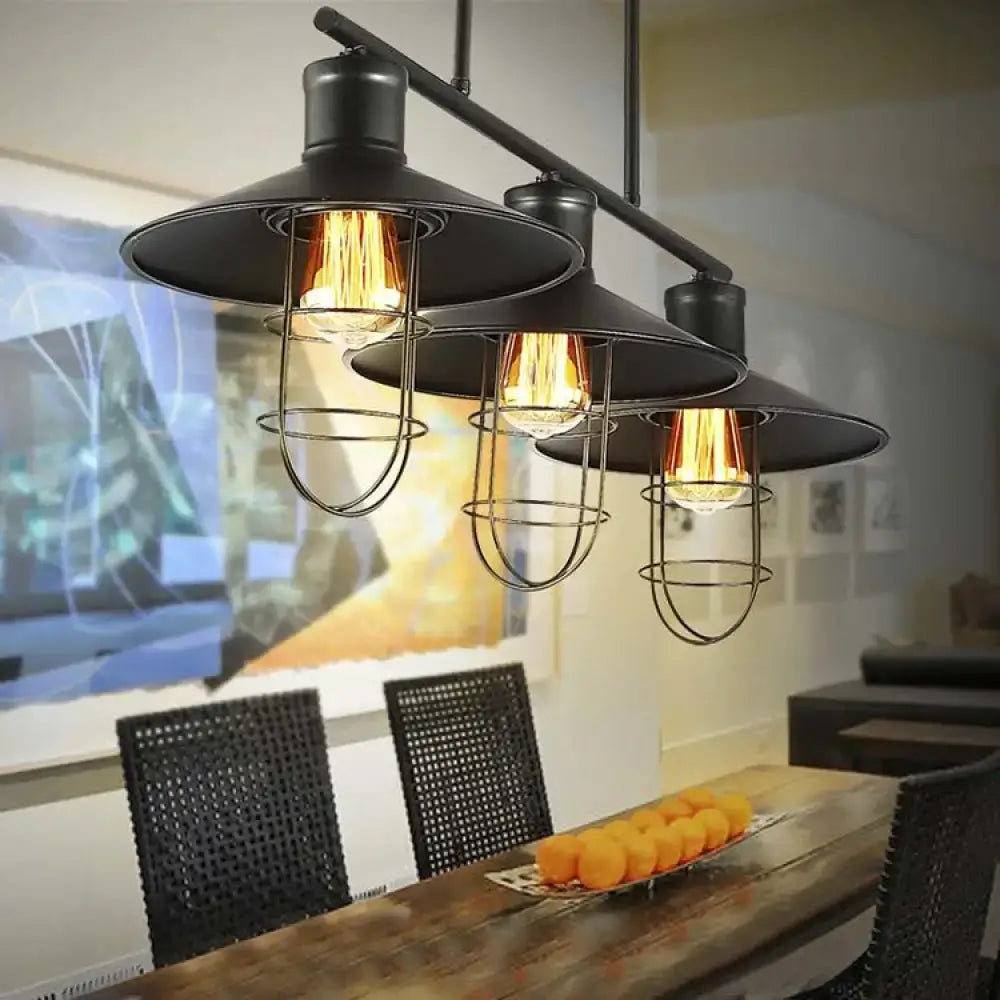 DecorBites™ Nautical Saucer island pendant lamp with three black metal wire cage shades and exposed filament bulbs