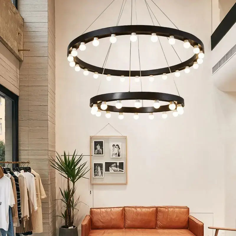 Black circular industrial duplex pendant light with two tiers of glowing bulbs for living room decorbites industrial duplex staircase