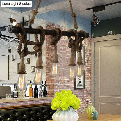 Industrial black pipe and rope chandelier with five edison bulbs for a linear restaurant island lighting fixture