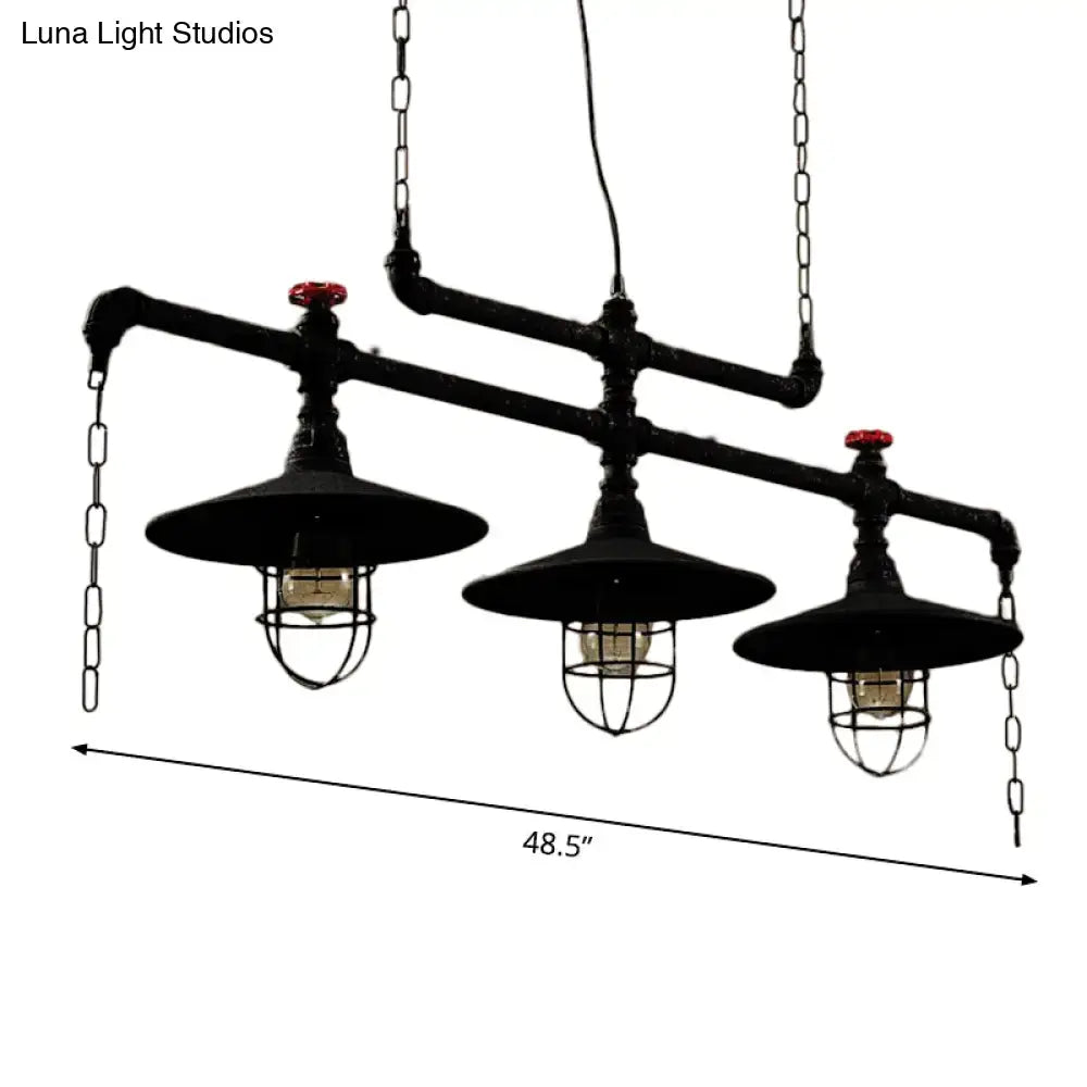 Industrial black pipe chandelier with three exposed bulbs and red valve caps for dining room lighting