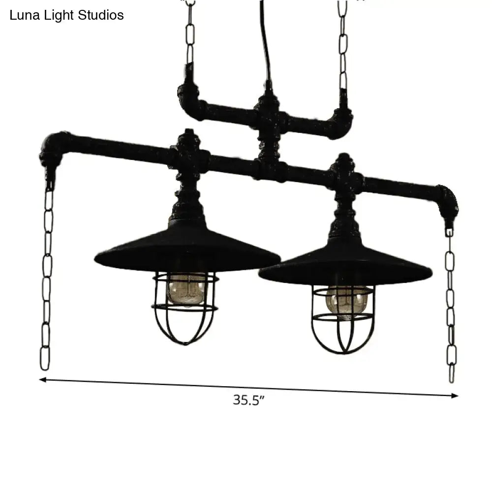 Industrial black pipe chandelier with red valve caps and two exposed bulb fixtures for dining room lighting