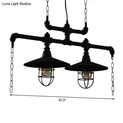 Industrial black pipe chandelier with red valve caps and two exposed bulb fixtures for dining room lighting