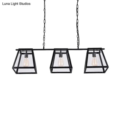 Decorbites black pyramid island light with three rectangular glass-encased bulbs in industrial metal design