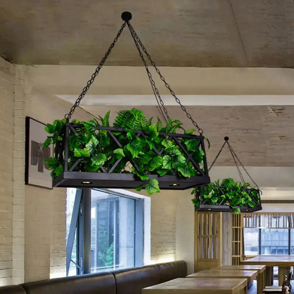Black metal hanging planter with geometric lattice design filled with green plants for decorbites industrial ceiling light
