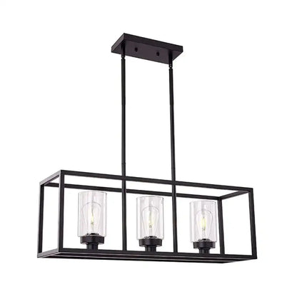 Black metal rectangular pendant light with three clear glass cylinders housing exposed filament bulbs for dining room