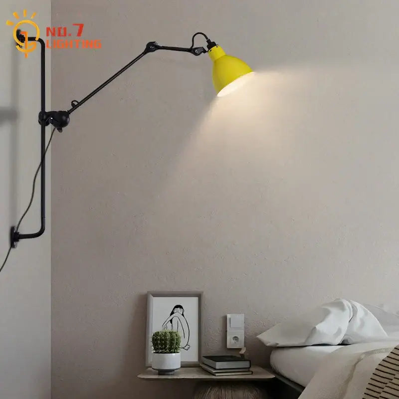 Yellow industrial-style wall lamp with black articulated arms and matte finish for decorbites adjustable rotating led use
