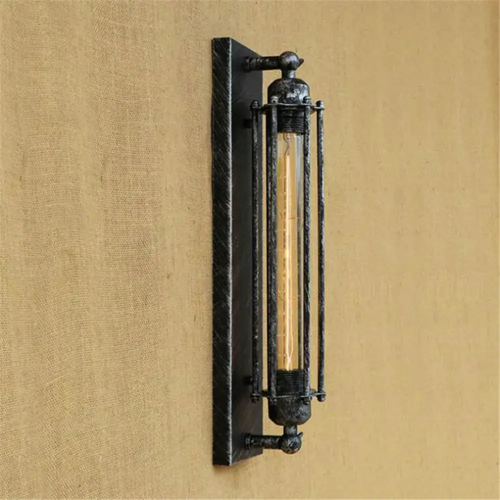 Industrial black rustic edison wall light featuring a black metal sconce with vertical bars and vintage edison bulb decorbites wall light