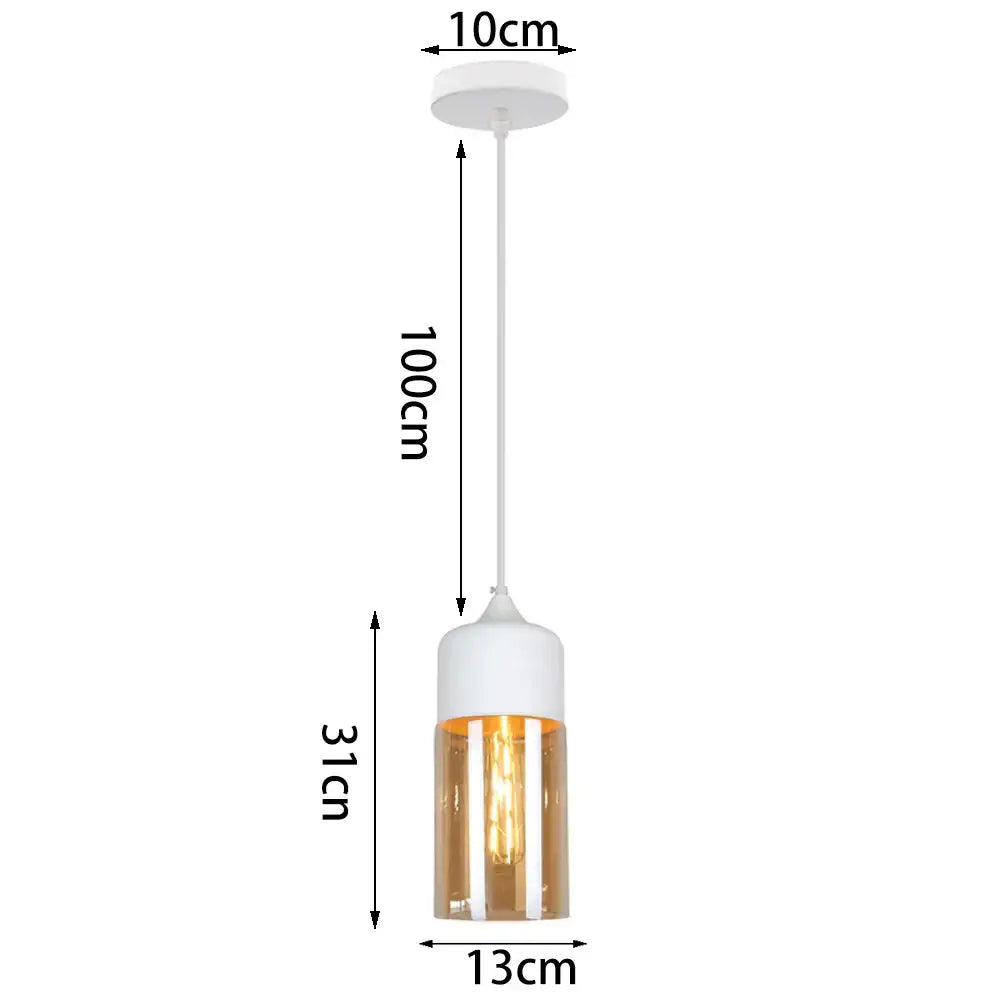A modern industrial pendant light with a white cylindrical top and amber glass shade pendant light for kitchen decor
