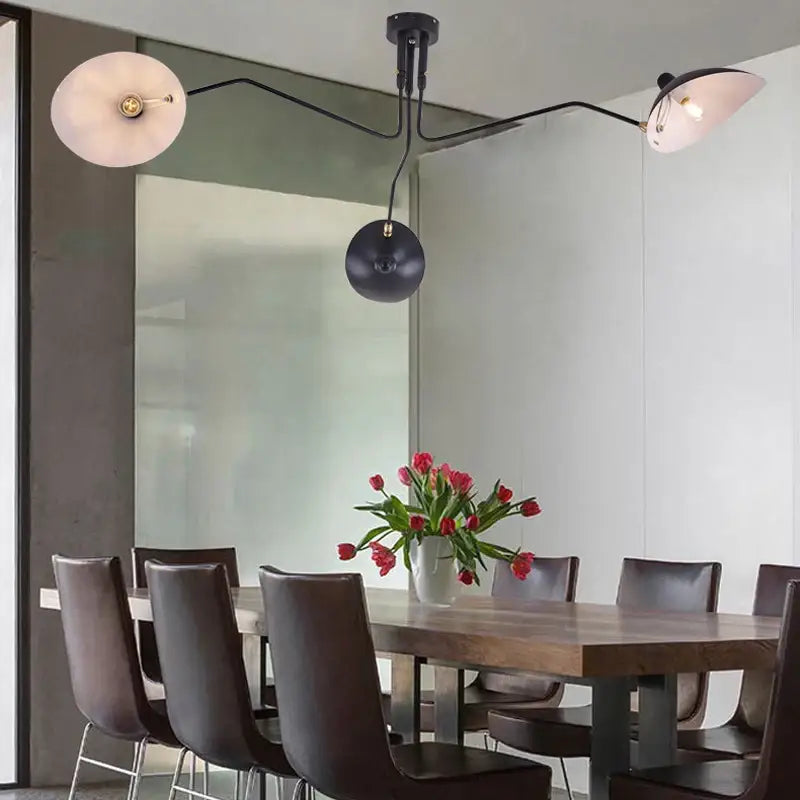Black metal swing arm chandelier with two frosted glass shades for industrial dining room decorbites black swing fixture