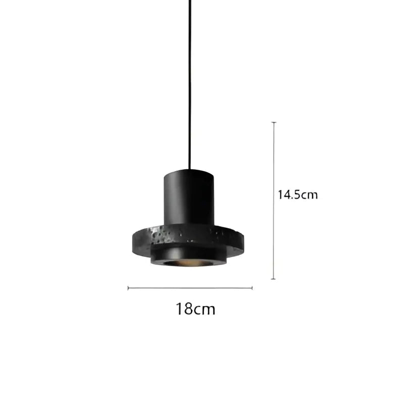 Industrial black travertine cement pendant light with cylindrical body and textured speckled circular base by decorbites black travertine