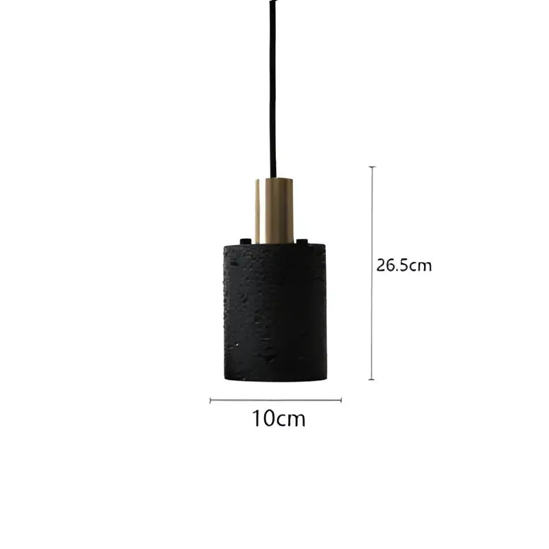 Industrial black travertine cement pendant light with textured black cylindrical shade and gold-toned metallic top