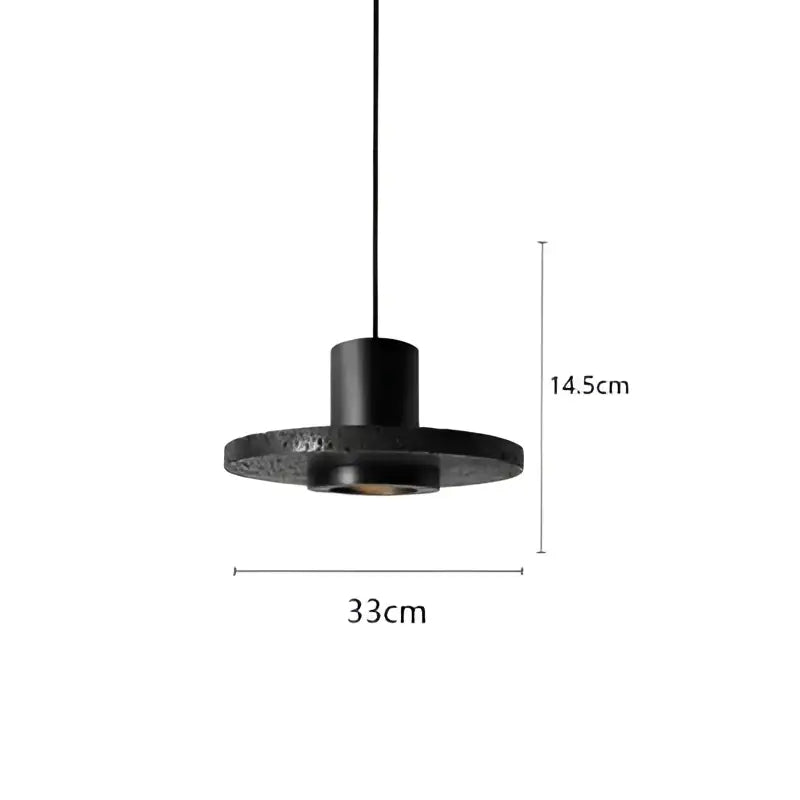 Industrial black travertine cement pendant light with textured cylindrical stem and circular base by decorbites black travertine