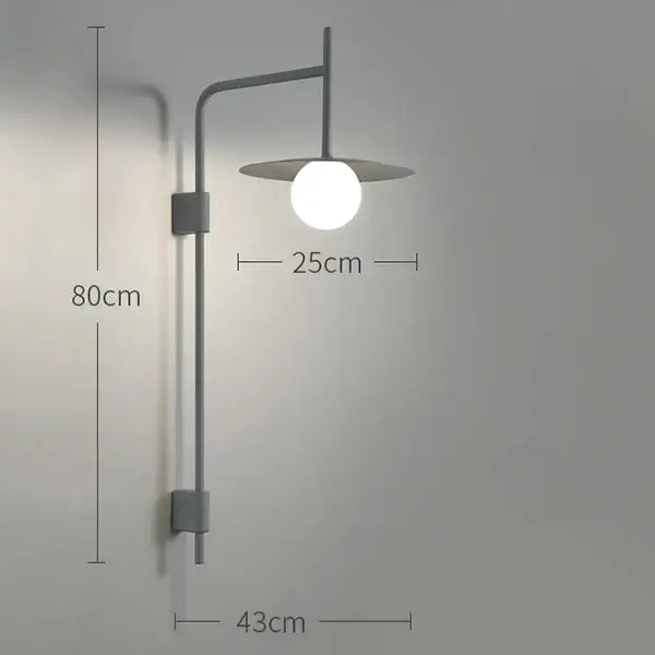 Modern gray metal wall lamp with spherical frosted bulb and flat shade in decorbites industrial style bedroom sconce