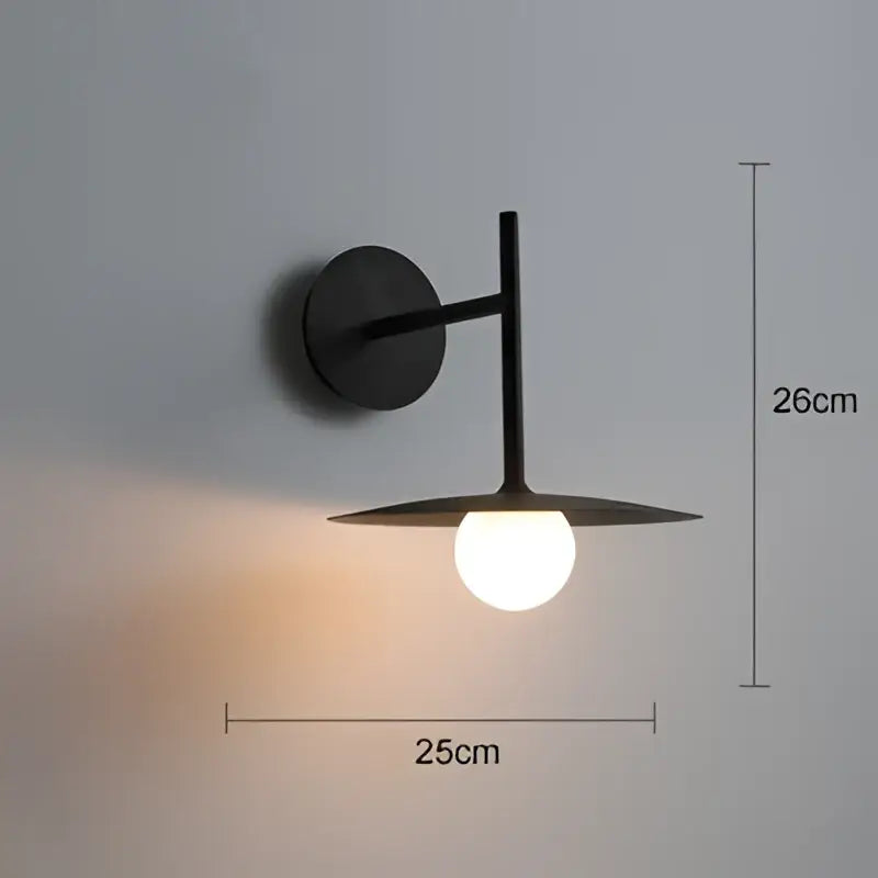 Black minimalist wall lamp with frosted glass globe and angular arm for decorbites industrial style wall lighting